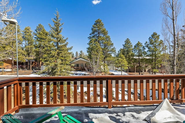 view of snow covered deck