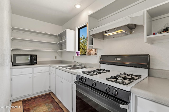 5744 N Julianne Dr, Williams, AZ 86046 - kitchen featuring open shelves, white range with gas cooktop, black microwave, and a sink