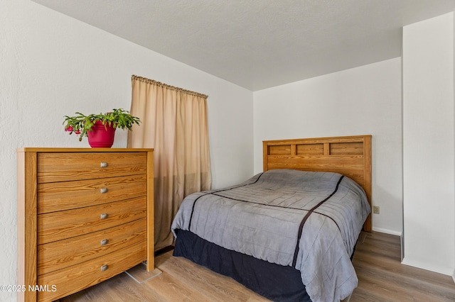 5744 N Julianne Dr, Williams, AZ 86046 - bedroom with wood finished floors and baseboards