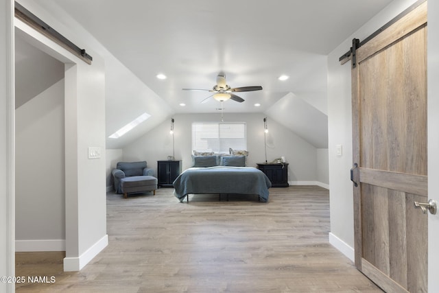 2385 W Mission Timber Cir, Flagstaff, AZ 86001 - bedroom with a barn door, vaulted ceiling, baseboards, light wood finished floors, and recessed lighting