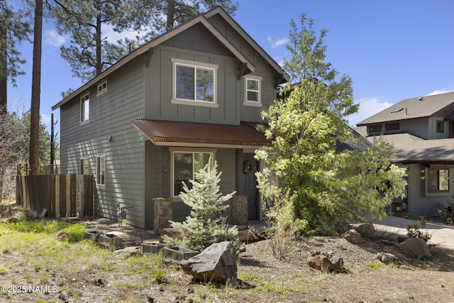2385 W Mission Timber Cir, Flagstaff, AZ 86001 - view of front of property with board and batten siding and fence