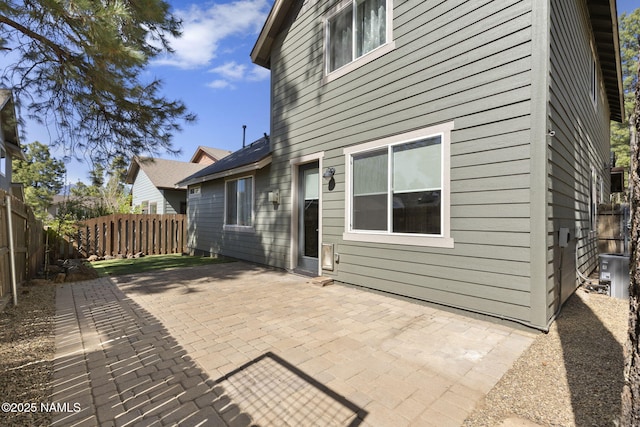 2385 W Mission Timber Cir, Flagstaff, AZ 86001 - back of house with a fenced backyard, a patio area, and central air condition unit