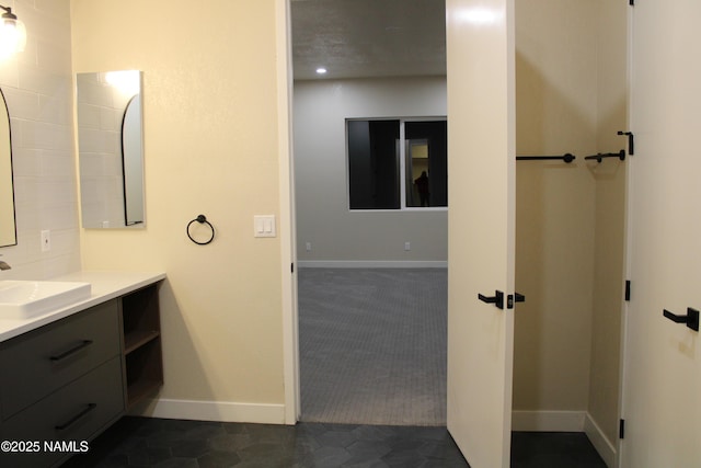 bathroom with tile patterned flooring and vanity