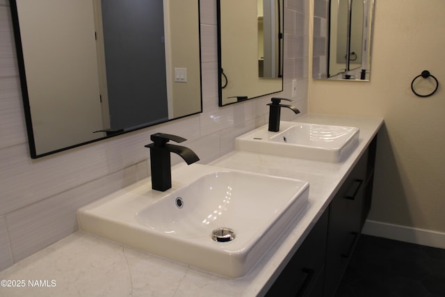 bathroom featuring tasteful backsplash and vanity