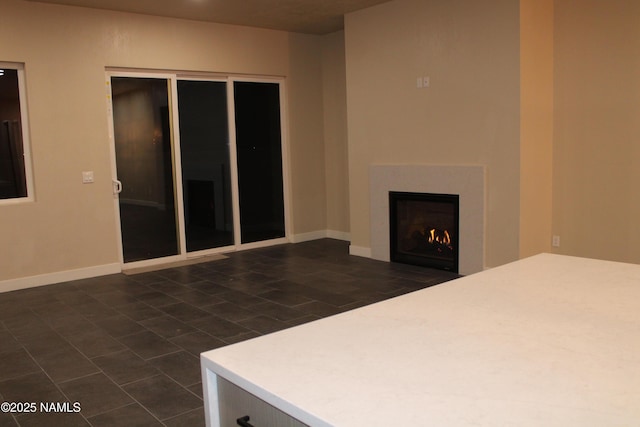 interior space featuring dark tile patterned flooring and a closet