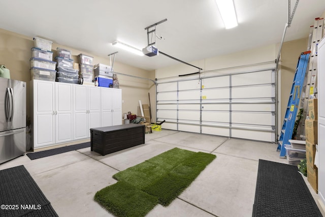 1248 W Lil Ben Trl, Flagstaff, AZ 86001 - garage featuring freestanding refrigerator and a garage door opener