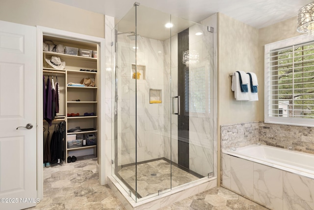1248 W Lil Ben Trl, Flagstaff, AZ 86001 - full bathroom featuring a garden tub, a marble finish shower, a walk in closet, and recessed lighting
