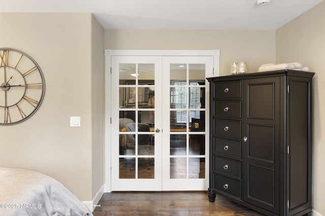 1248 W Lil Ben Trl, Flagstaff, AZ 86001 - bedroom with french doors, dark wood-style floors, and baseboards