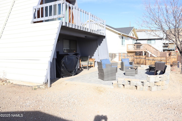 exterior space with an outdoor living space, a deck, and a patio