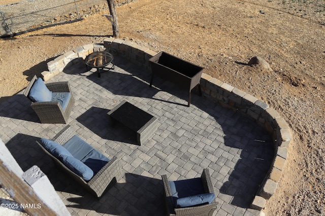 exterior details featuring an outdoor fire pit