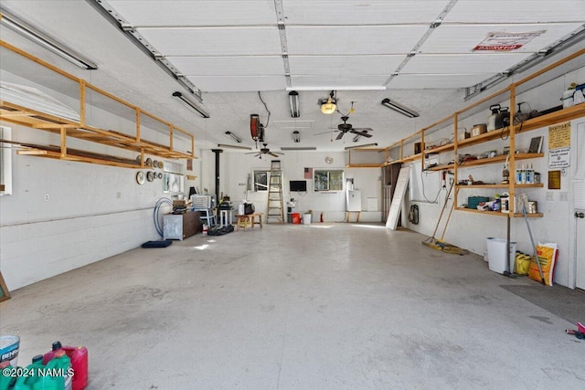 garage featuring a garage door opener and ceiling fan