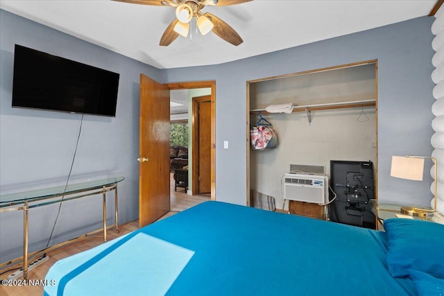 bedroom featuring hardwood / wood-style flooring, a closet, and ceiling fan