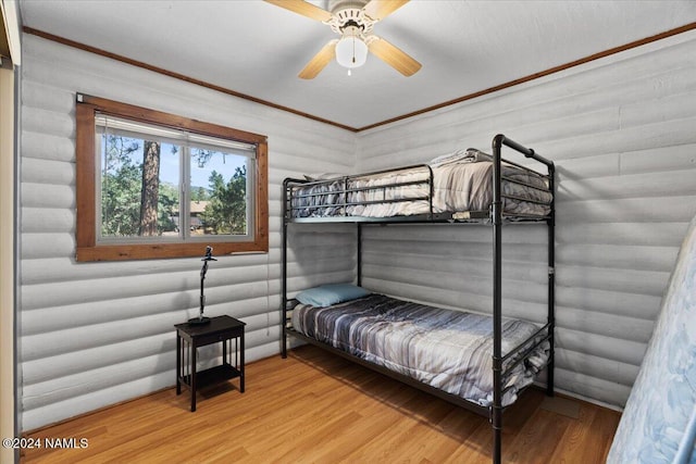 bedroom featuring ceiling fan and hardwood / wood-style flooring