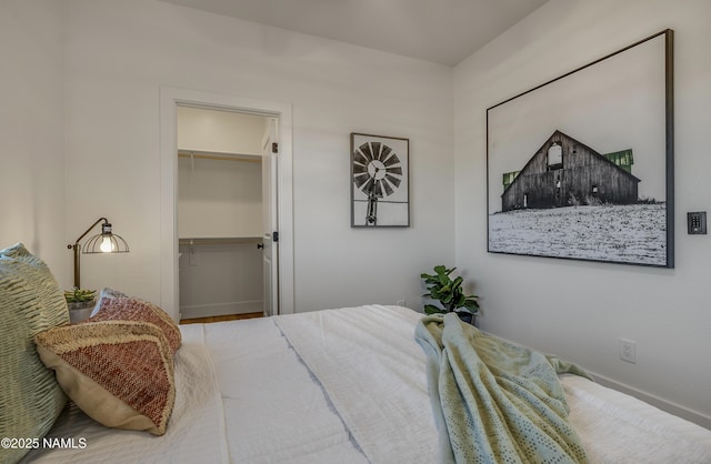 6710 N Isabella St, Williams, AZ 86046 - bedroom featuring a walk in closet and baseboards