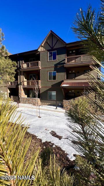 view of snow covered property