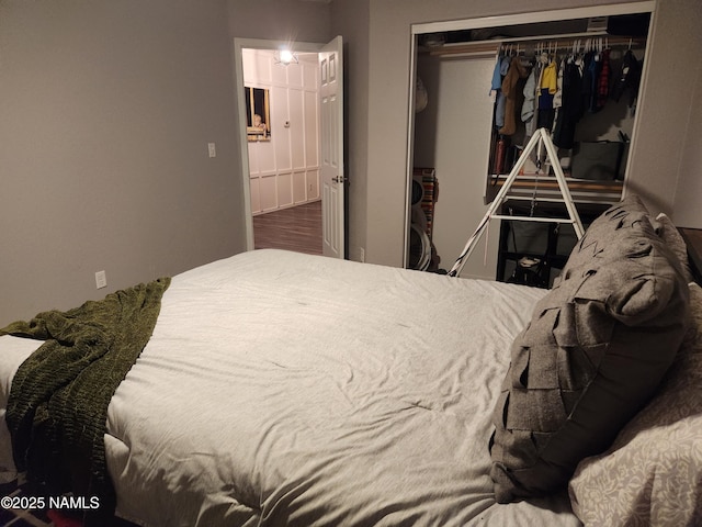 bedroom featuring a closet and wood finished floors