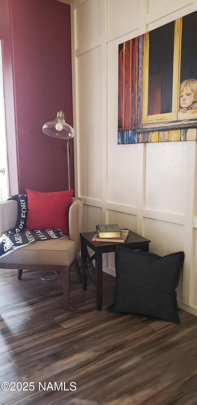 sitting room featuring wood finished floors