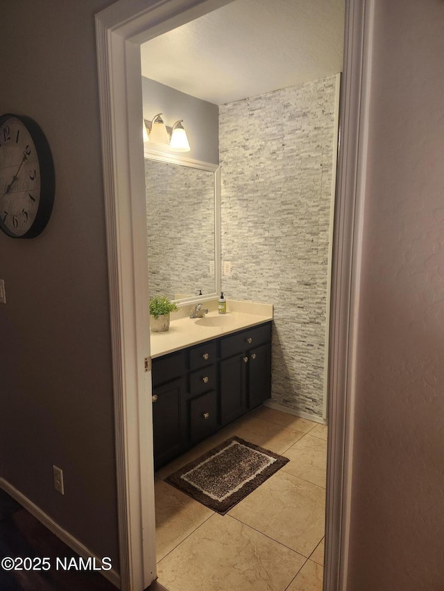 bathroom with tile patterned flooring and vanity