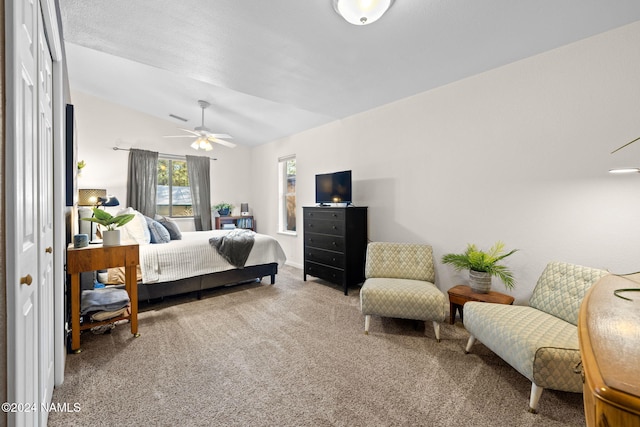 bedroom featuring lofted ceiling, carpet floors, and ceiling fan