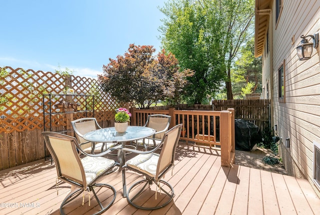2197 E Arroyo Seco Dr, Flagstaff, AZ 86004 - wooden terrace featuring outdoor dining space and a grill