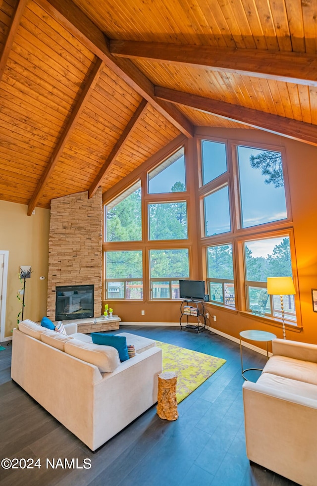 living room with wooden ceiling, beam ceiling, high vaulted ceiling, and a stone fireplace