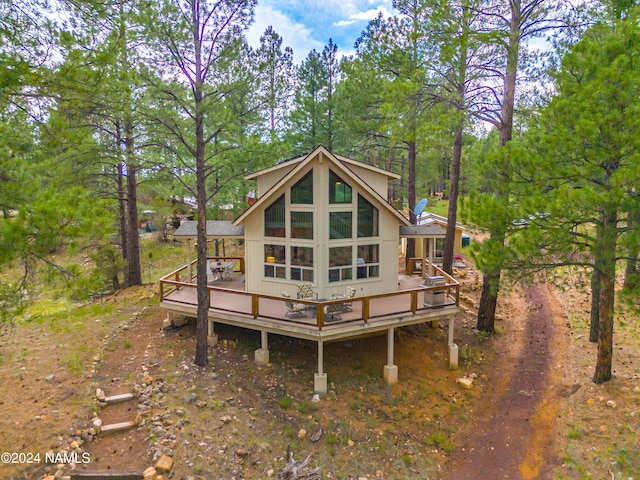 back of property featuring a wooden deck