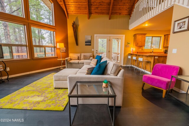 living room featuring dark hardwood / wood-style flooring, beam ceiling, high vaulted ceiling, and wood ceiling