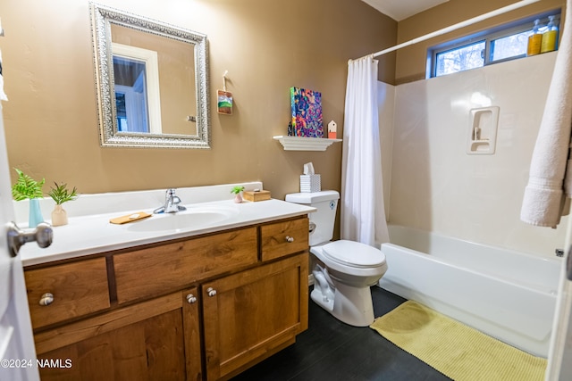 full bathroom with toilet, vanity, and shower / tub combo