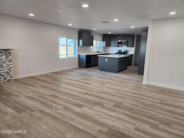 515 W Aspinwall St, Winslow, AZ 86047 - kitchen with appliances with stainless steel finishes, light countertops, a sink, open floor plan, and recessed lighting