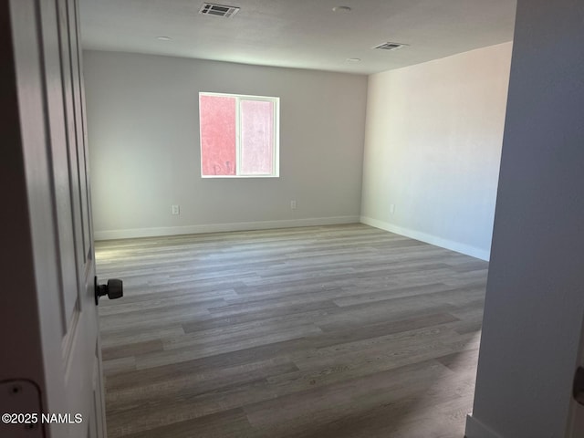 515 W Aspinwall St, Winslow, AZ 86047 - unfurnished room with wood finished floors and baseboards