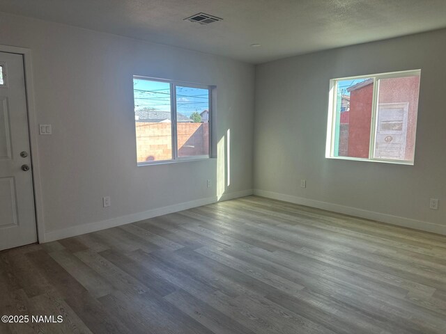 515 W Aspinwall St, Winslow, AZ 86047 - unfurnished room with wood finished floors and baseboards