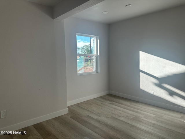 515 W Aspinwall St, Winslow, AZ 86047 - unfurnished room featuring wood finished floors and baseboards