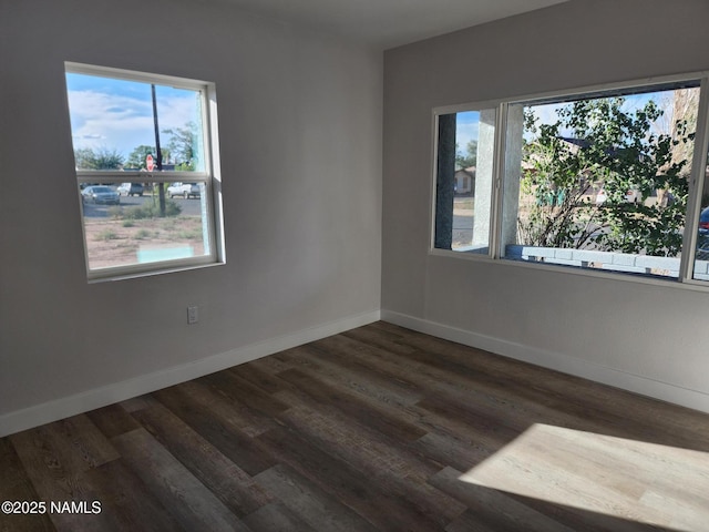 515 W Aspinwall St, Winslow, AZ 86047 - empty room featuring dark wood finished floors and baseboards