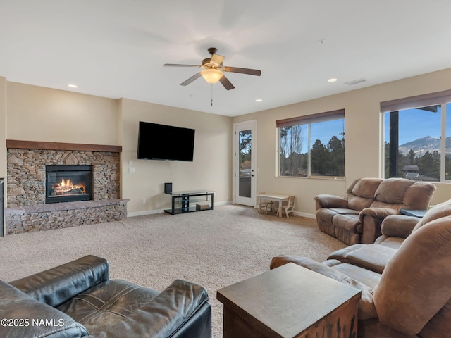 449 E Woodland Dr, Flagstaff, AZ 86001 - living area featuring a fireplace, baseboards, carpet, and a ceiling fan