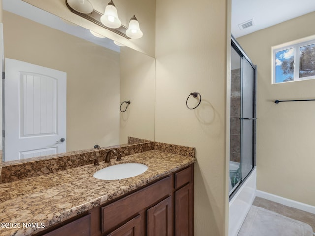449 E Woodland Dr, Flagstaff, AZ 86001 - bathroom with vanity, baseboards, visible vents, enclosed tub / shower combo, and tile patterned floors