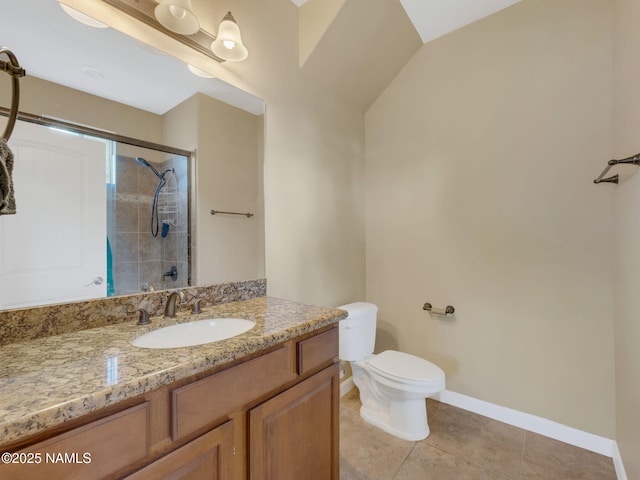 449 E Woodland Dr, Flagstaff, AZ 86001 - bathroom featuring tile patterned flooring, baseboards, toilet, a tile shower, and vanity