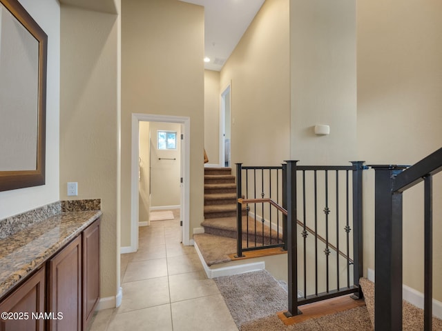 449 E Woodland Dr, Flagstaff, AZ 86001 - stairway with tile patterned floors and baseboards