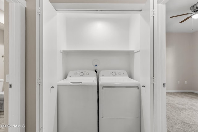 laundry area featuring carpet flooring, washing machine and dryer, and ceiling fan