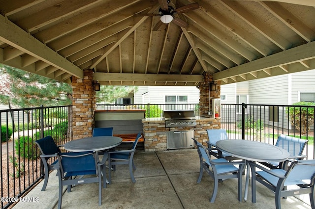 view of patio with ceiling fan, a gazebo, exterior kitchen, and a grill