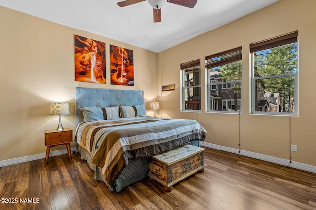 bedroom with baseboards, a ceiling fan, and wood finished floors