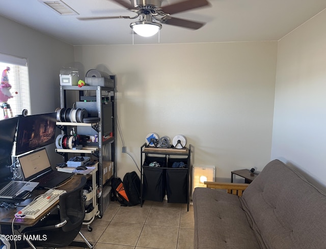 office space featuring visible vents, tile patterned floors, and a ceiling fan