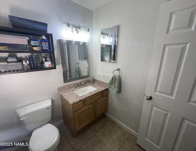 half bath with baseboards, toilet, tile patterned flooring, and vanity