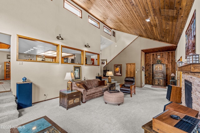 2201 N Rio De Flag Dr, Flagstaff, AZ 86004 - living room with carpet flooring, a high ceiling, wood ceiling, stairway, and a fireplace