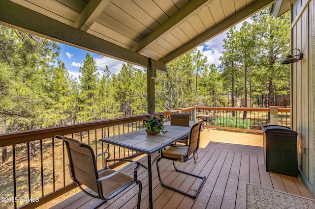 2201 N Rio De Flag Dr, Flagstaff, AZ 86004 - deck featuring outdoor dining space and view of scattered trees