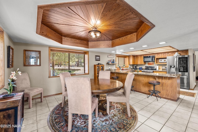 2201 N Rio De Flag Dr, Flagstaff, AZ 86004 - dining space featuring a tray ceiling, light tile patterned floors, recessed lighting, and wooden ceiling