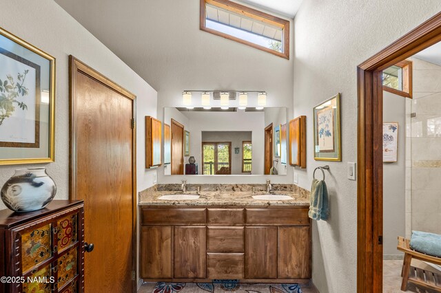 2201 N Rio De Flag Dr, Flagstaff, AZ 86004 - full bath with double vanity and a textured wall