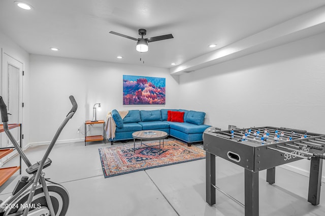 rec room featuring concrete floors and ceiling fan