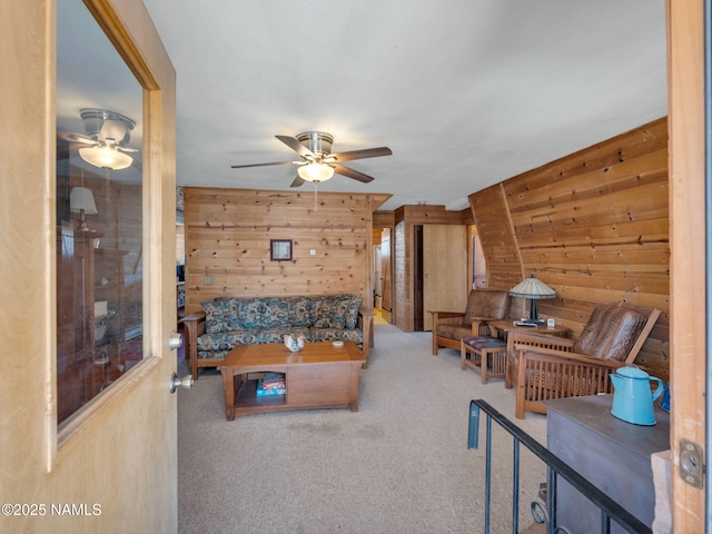 7284 N Buck Ridge Rd, Williams, AZ 86046 - living room featuring ceiling fan, wooden walls, and carpet flooring
