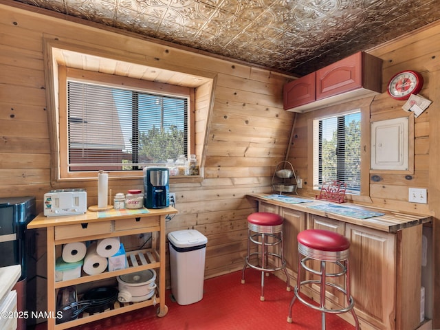 7284 N Buck Ridge Rd, Williams, AZ 86046 - kitchen featuring wood walls, an ornate ceiling, electric panel, and butcher block countertops