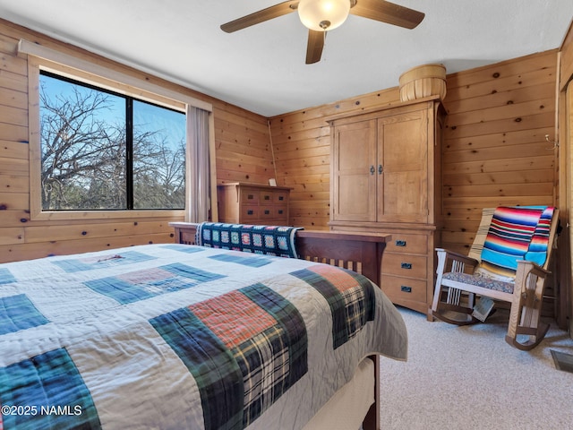 7284 N Buck Ridge Rd, Williams, AZ 86046 - carpeted bedroom with wooden walls and a ceiling fan